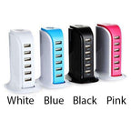 Four USB chargers in white, blue, black, and pink on a white background.