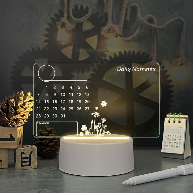 Decorative night light with calendar and floral design on a dark background